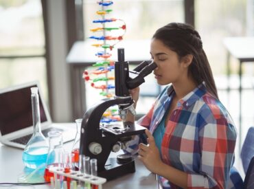 [fpdl.in]_attentive-schoolgirl-looking-through-microscope-laboratory_107420-85733_large